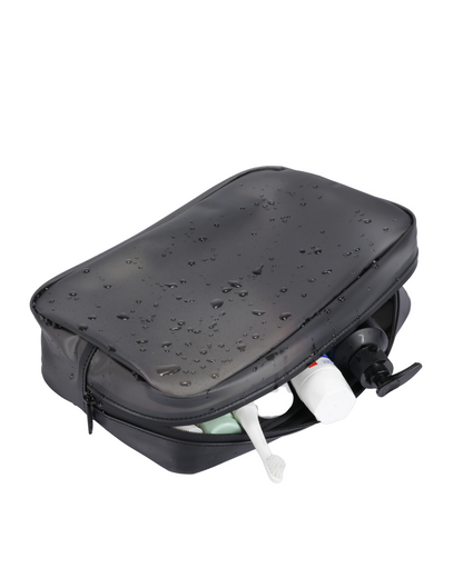 Black toiletry bag with shower head and bottles on a white background