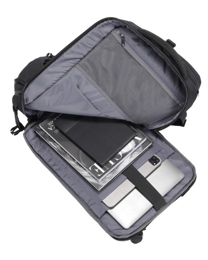 Open travel bag with compartments for electronic devices on a white background
